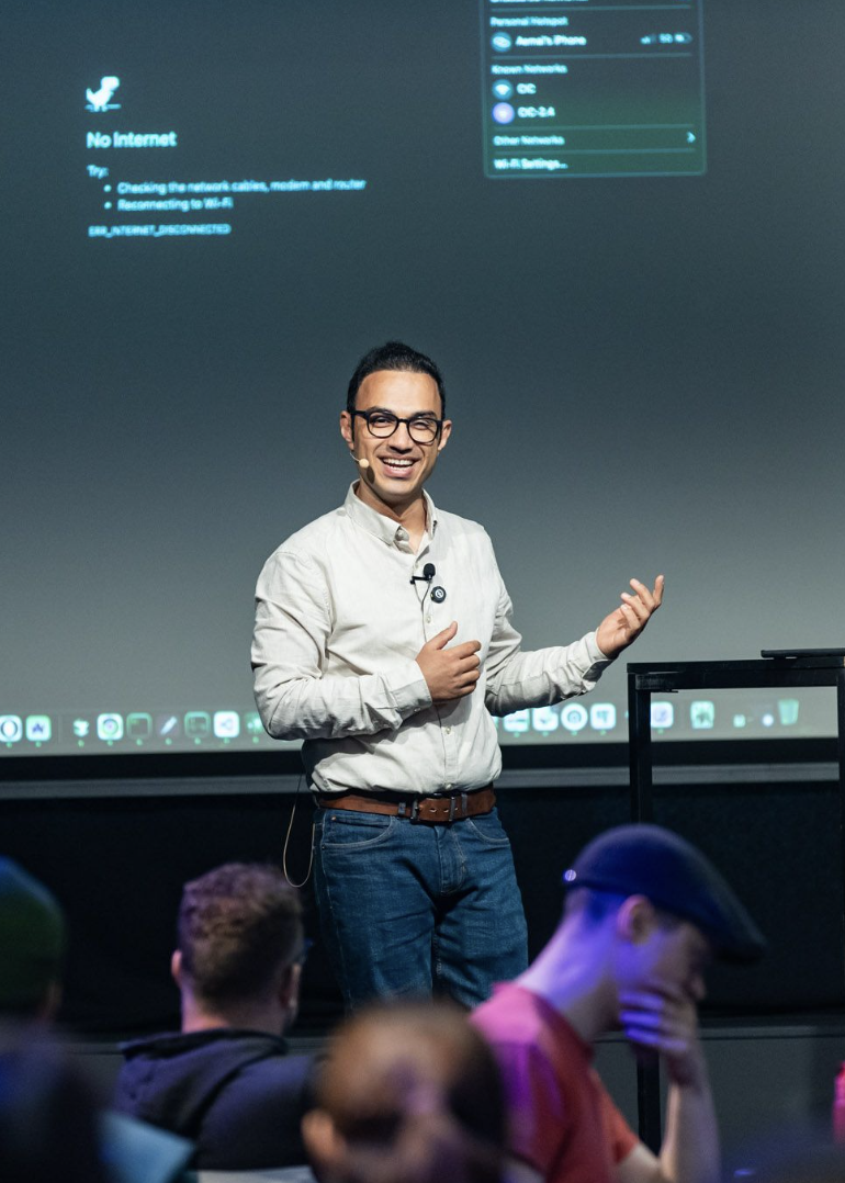 Aemal at the workshop with No internet projected behind him